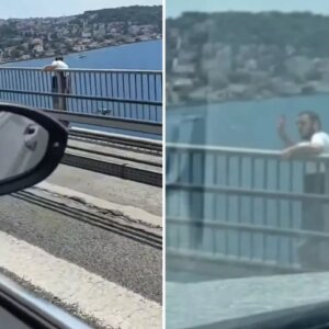 kopruye cikan sahis el salladiktan sonra kendini bosluga birakti cjsMz6z6